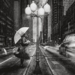 woman in rain with umbrella and cars passing by