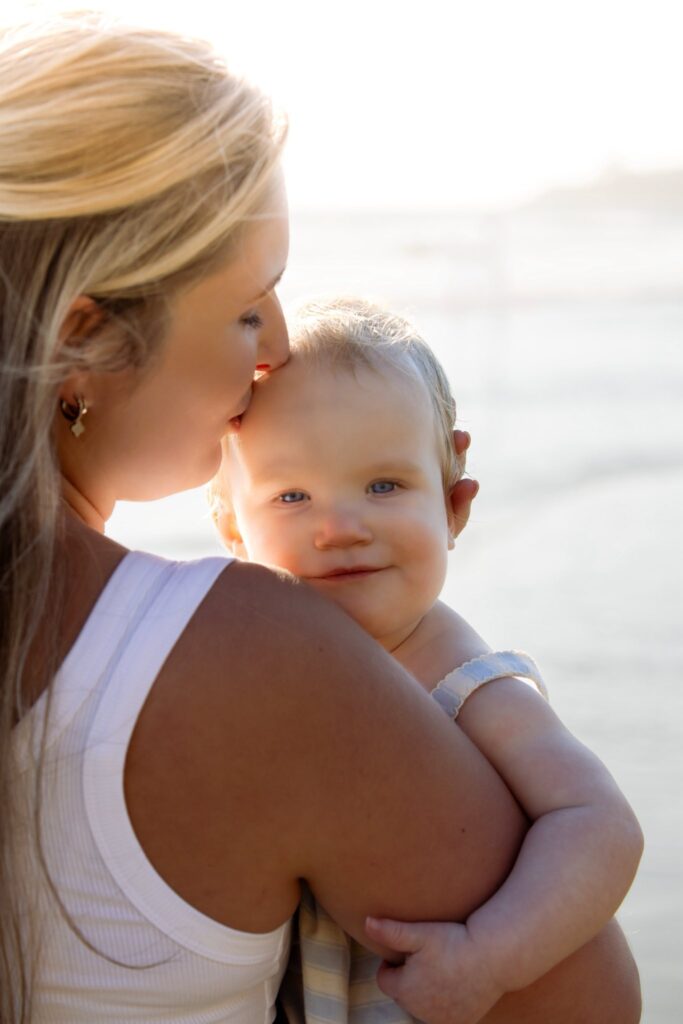 mom holding baby