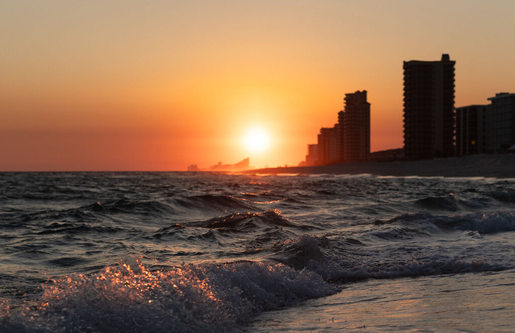 sunset at the coast and ocean waves