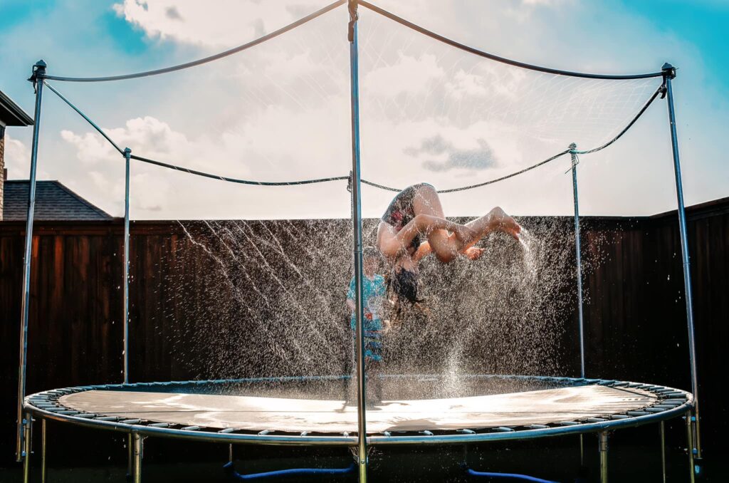 kids jumping on trampoline