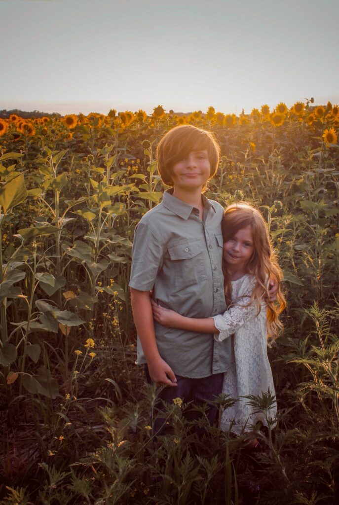 kids in sunflower field