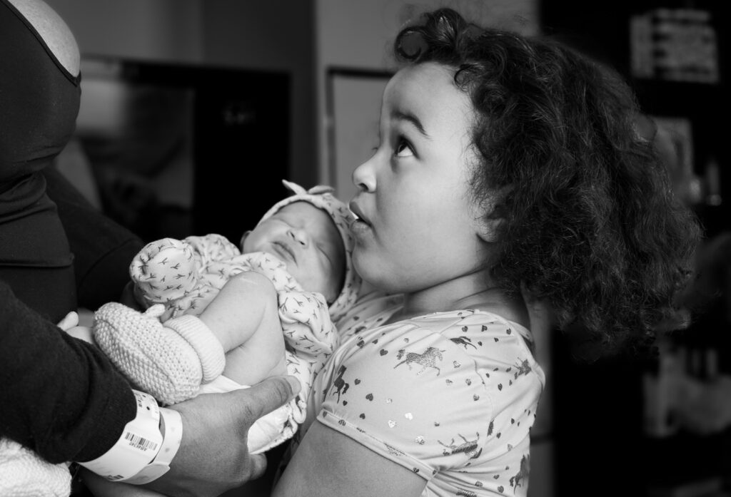 older sibling with baby sibling