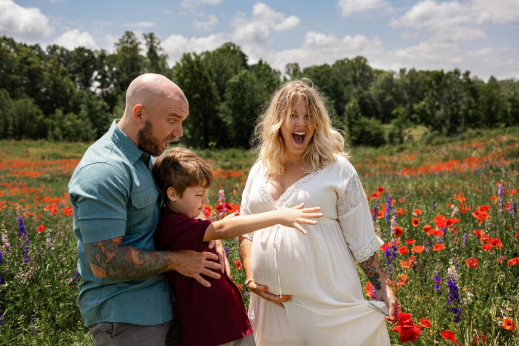 maternity session family of three in field of flowers