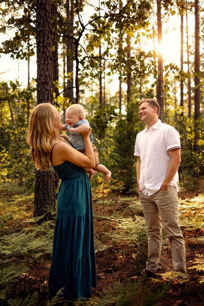 family of three laughing