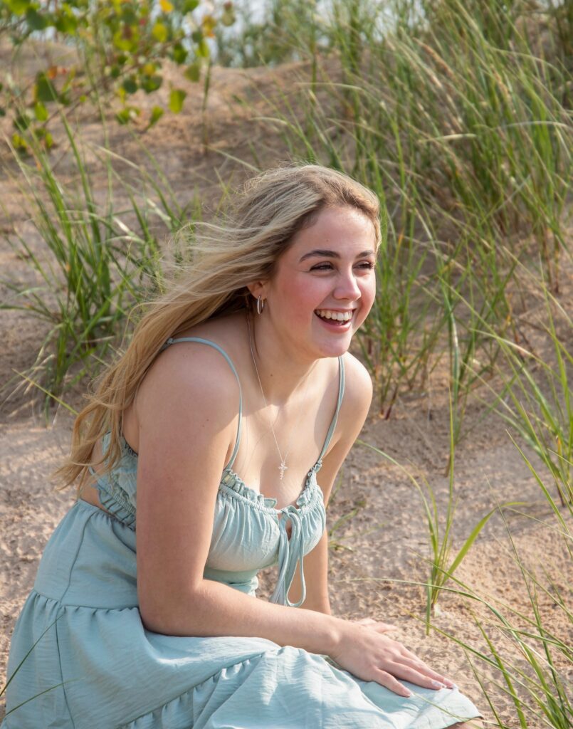 portrait of young woman laughing in the wind