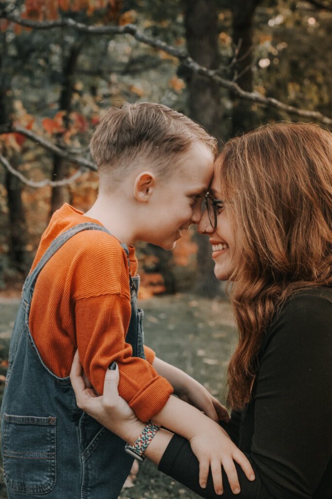 mother and son smiling at each other