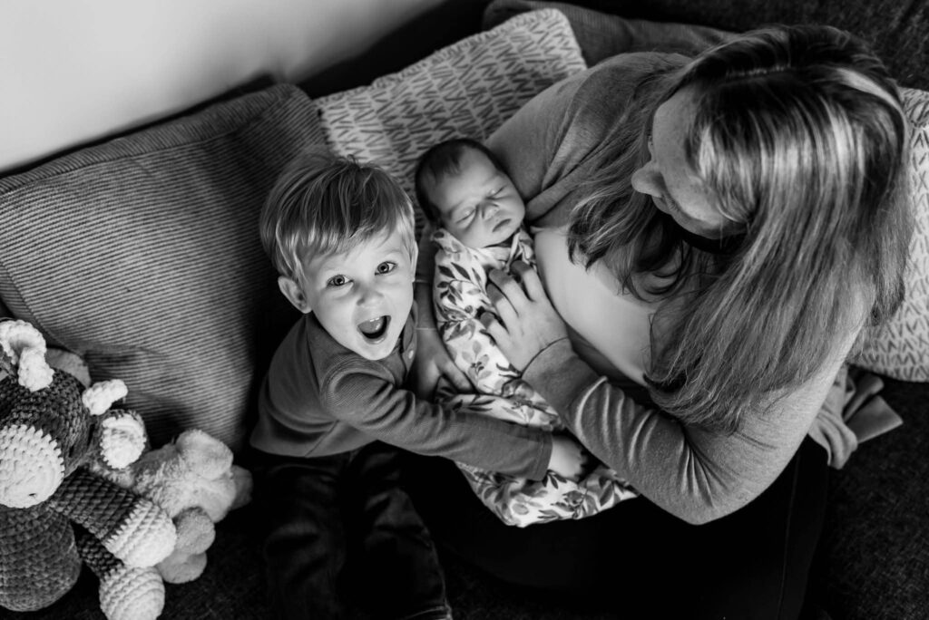 Birds eye view of mom with kids sitting on couch