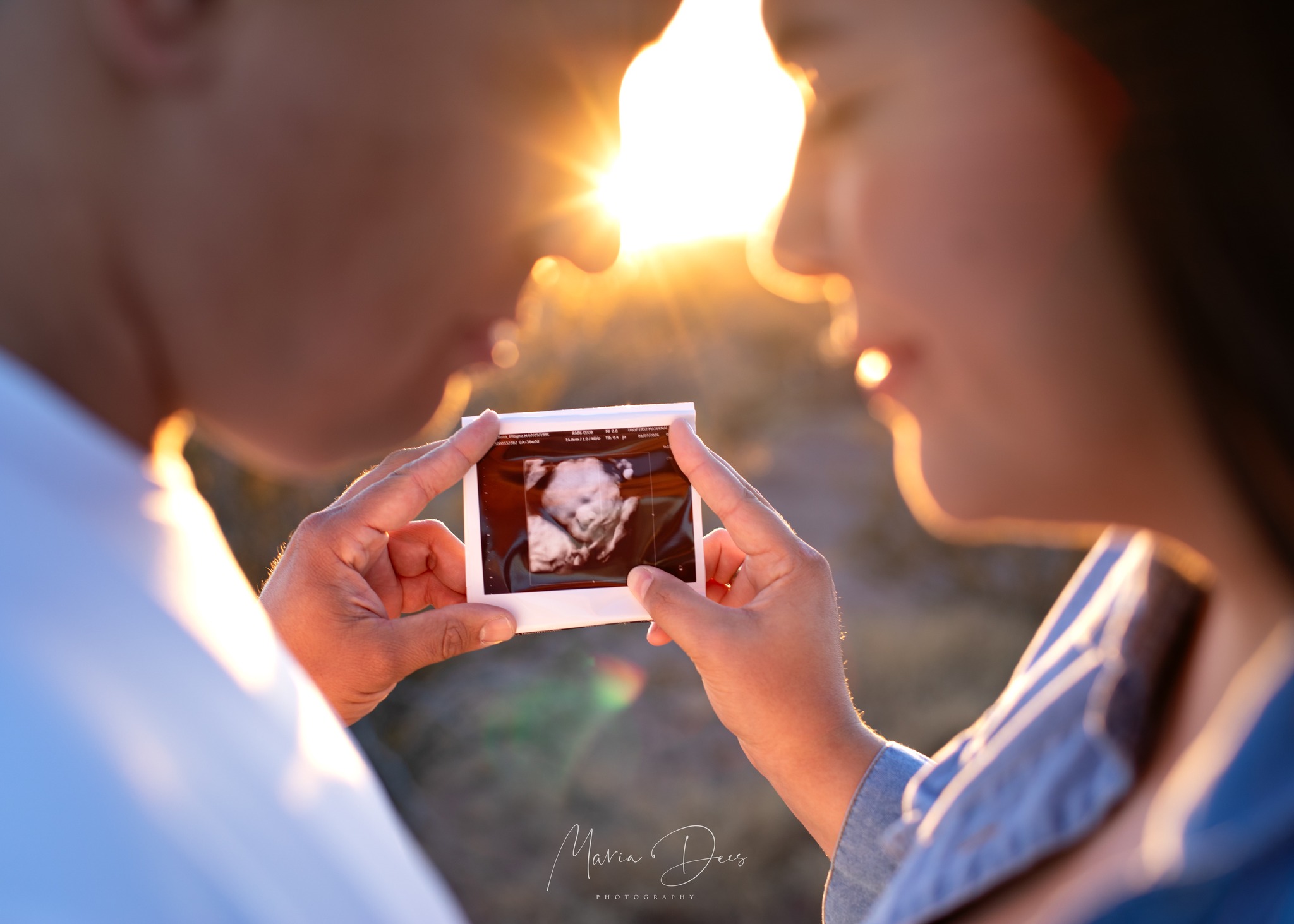 Maria Dees Photography - Photo of couple holding ultrasound picture of baby