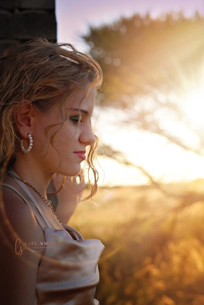 side portrait of young woman with golden light